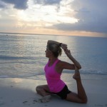 Yoga on the beach in Cayman - Pigeon pose