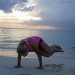 Yoga on the beach in Cayman – Side Crow pose